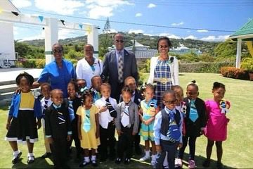 PM Philip J Pierre with children on the occasion of International Children's Day. (Credits: Philip J. Pierre, Facebook)
