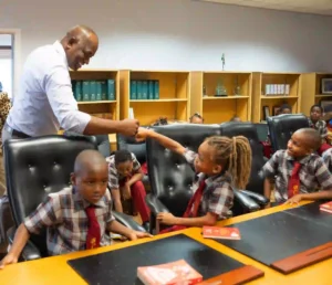Prime Minister Dr. Roosevelt Skerrit with the students of Bellevue Chopin Primary School 