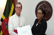 Apostolic Nuncio Santiago De Wit Guzman with President Sylvanie Burton 