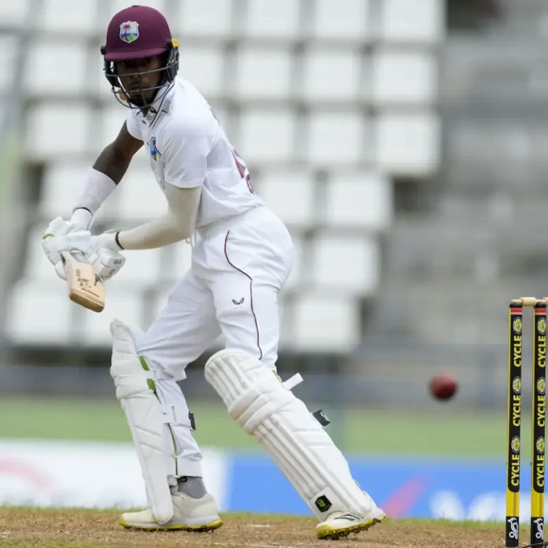 Roseau, Dominica: Roosevelt Skerrit, Prime Minister of Commonwealth of Dominica, appreciates young cricketer Alick Athtanaze for his brilliant knock 47 against India during day 1 of the 1st Test match at Windsor Park Stadium