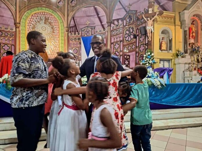 PM Philip J Pierre along with children during the Sunday Church Meeting. (Credits: Philip J. Pierre, Facebook)