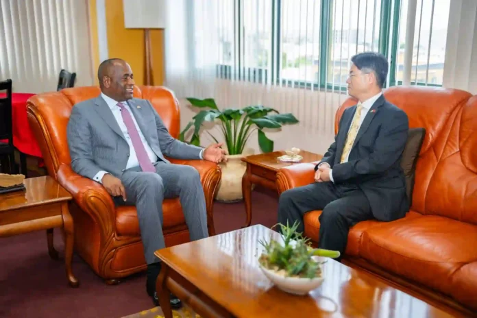 Prime Minister Dr. Roosevelt Skerrit with new Chinese Ambassador Chu Maoming