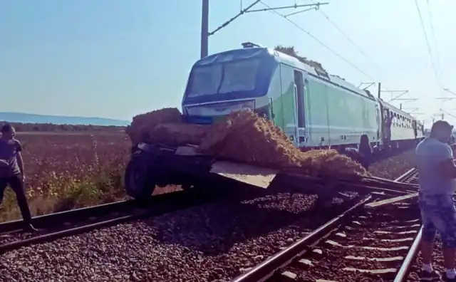 Emergency responders inspect the wreckage of a horse-drawn cart after it was struck by a passenger train at a railway crossing in Pevtsite, Bulgaria, on July 2, 2025