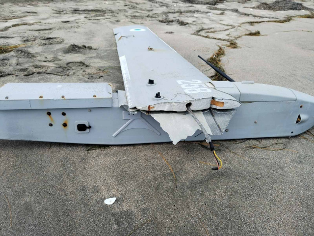 A corroded drone lies on Burgas’ North Beach after being recovered by naval experts