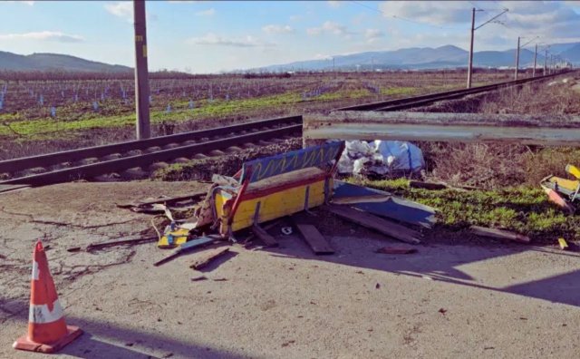 Police and investigators examine the Debelata Koriya railway crossing near Sliven following the fatal collision with a Sofia–Burgas passenger train